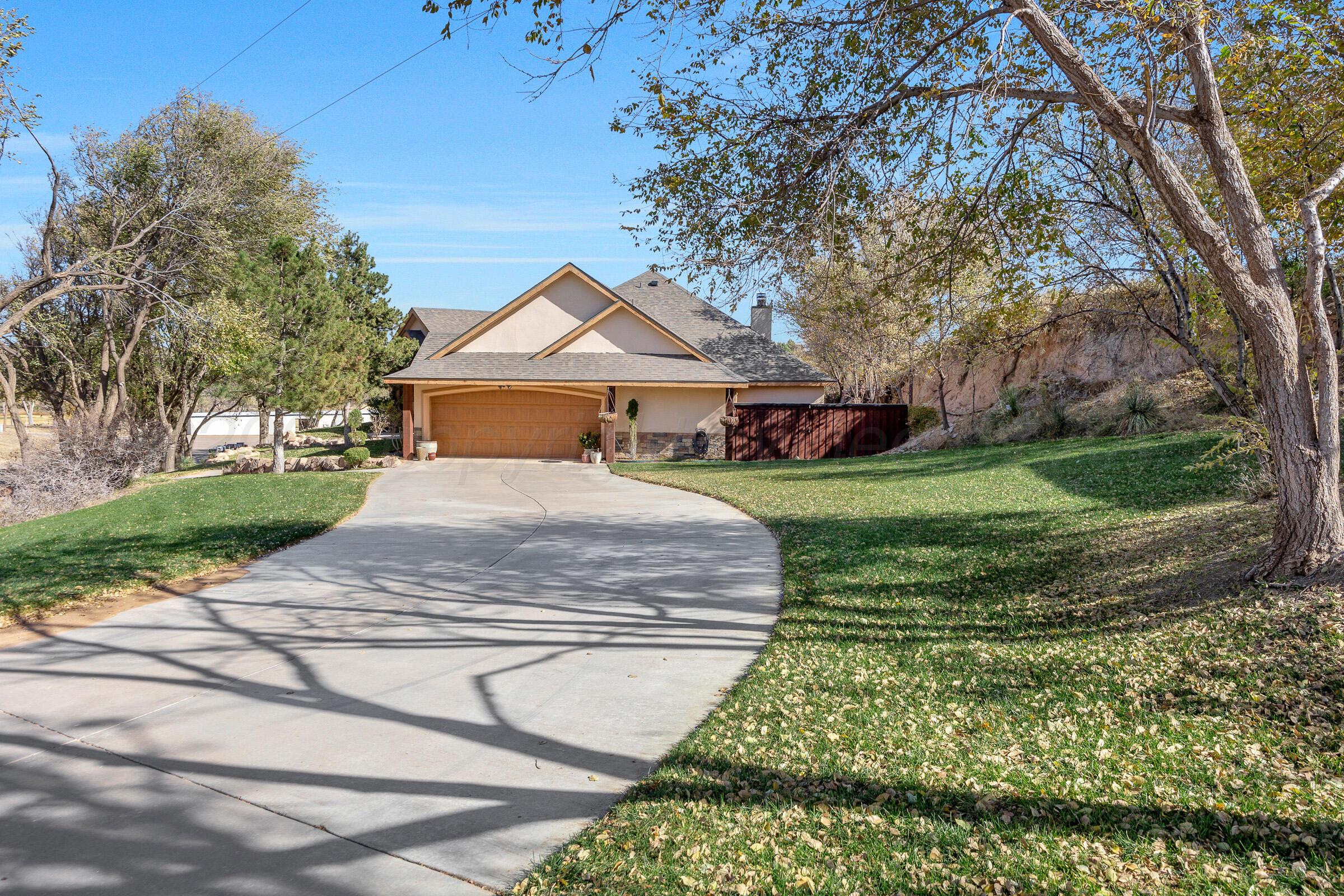 19551 Chaparral Road Canyon, TX 79015 - Photo 41 of 42 a view of a white house with a big yard and large tree