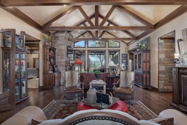 a living room with lots of furniture and a chandelier