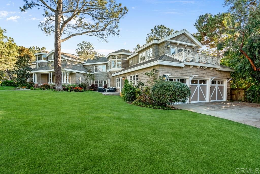 13598 Nogales Drive Del Mar, CA 92014 - Photo 2 of 21 a front view of a house with a garden
