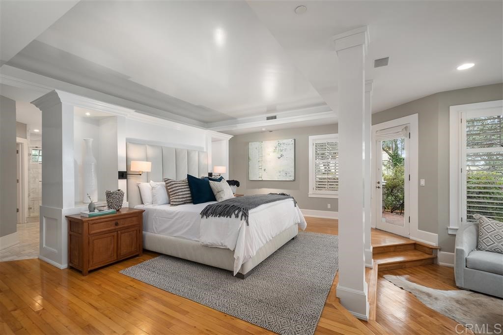 13598 Nogales Drive Del Mar, CA 92014 - Photo 11 of 21 a spacious bedroom with a bed a couch and large window