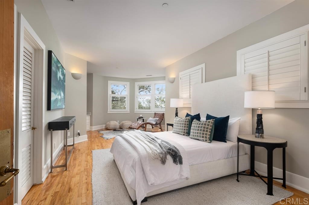 13598 Nogales Drive Del Mar, CA 92014 - Photo 15 of 21 a bedroom with a bed and a lamp on table