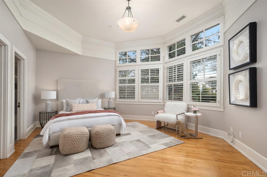 13598 Nogales Drive Del Mar, CA 92014 - Photo 16 of 21 a bedroom with a large bed and a window
