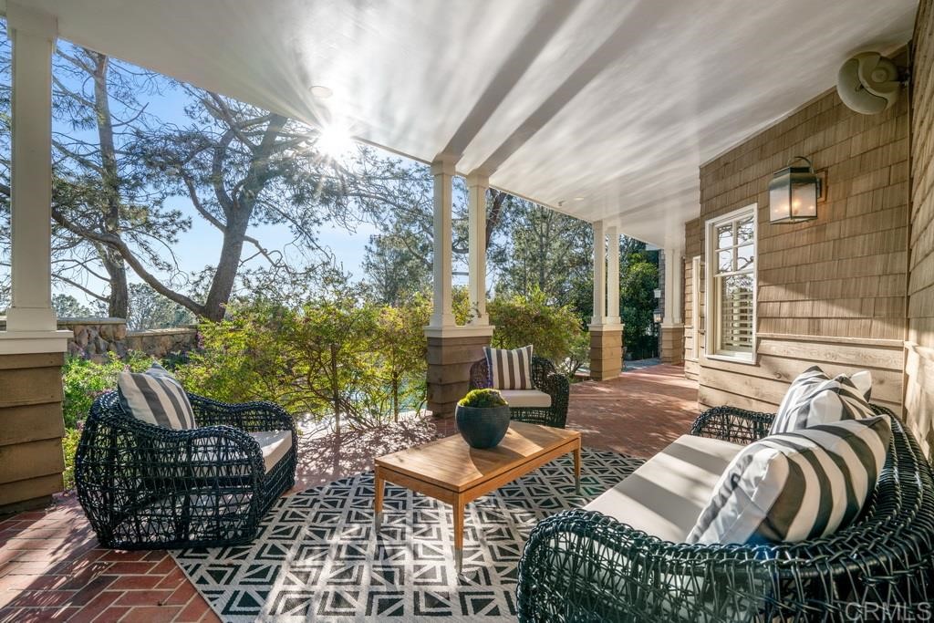13598 Nogales Drive Del Mar, CA 92014 - Photo 18 of 21 a living room with furniture and a floor to ceiling window