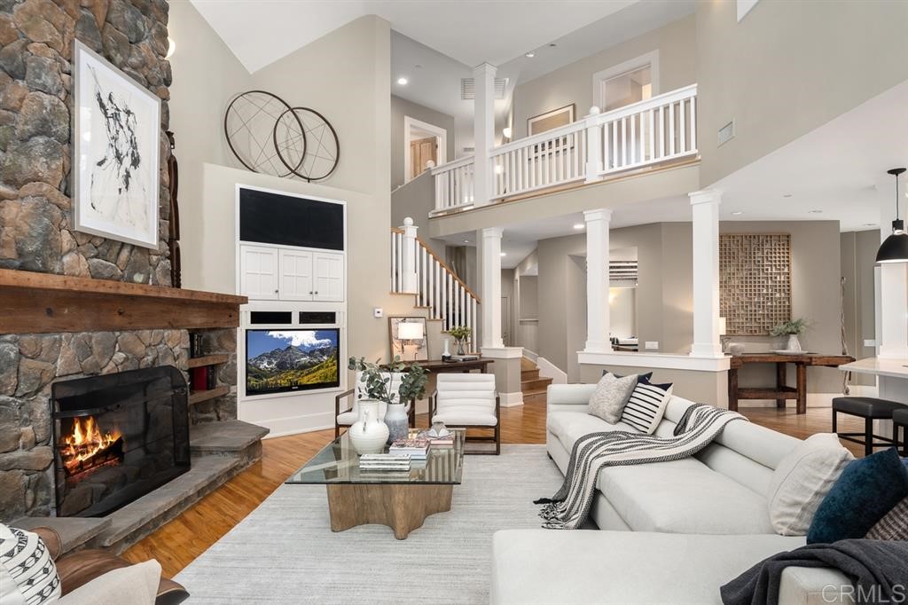 13598 Nogales Drive Del Mar, CA 92014 - Photo 7 of 21 a living room with furniture a fireplace and a flat screen tv