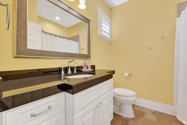 714 Draper Heights Way Draper, UT 84020 - Photo 40 of 88 Full bath featuring vanity, a shower with curtain, and light stone finish floors