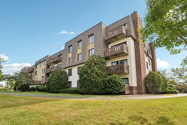 a view of a building with a yard