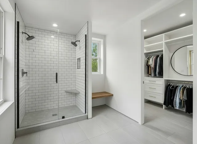 a bathroom with a shower and a sink