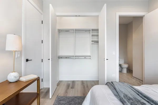 a bedroom with a bed and a table in it