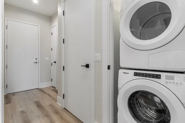 a view of a hallway with washer and dryer
