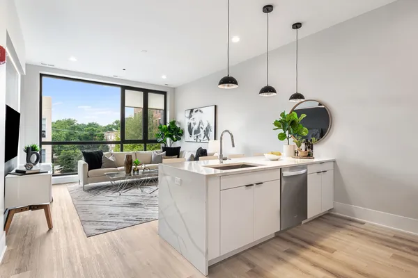 a view of living room with a sink and floor to ceiling window