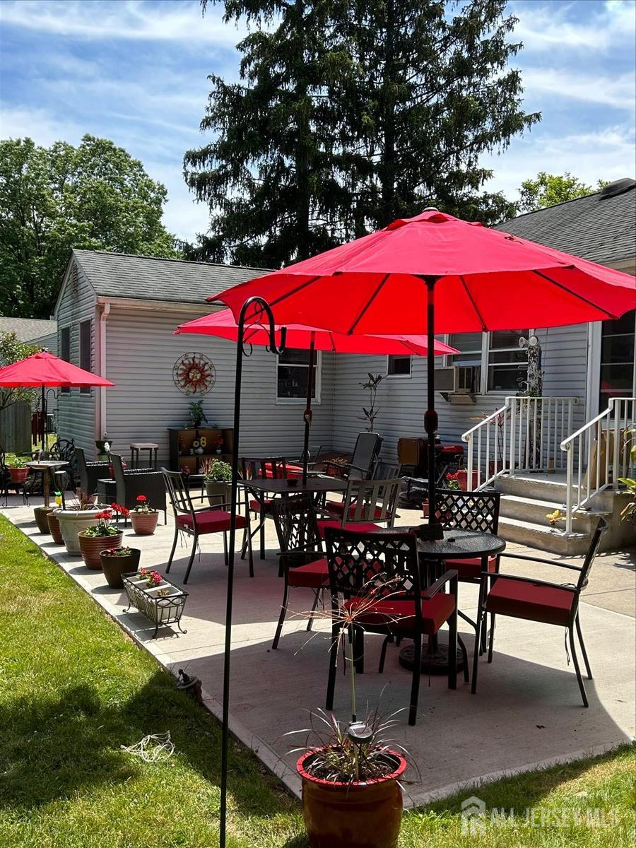 33 Ellison Road Somerset, NJ 08873 - Photo 24 of 38 a view of a patio with chairs and a patio