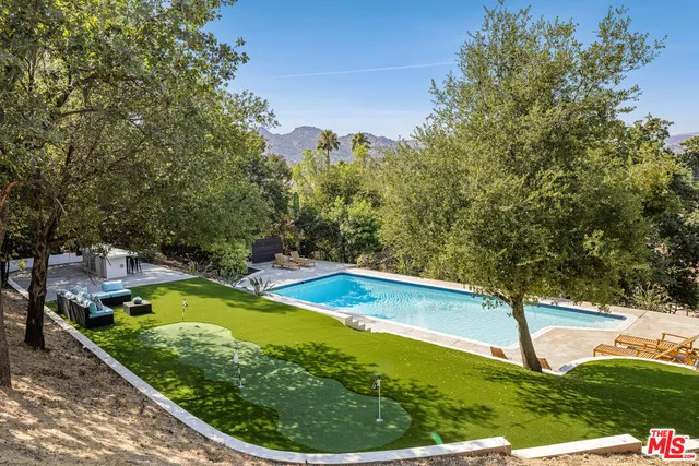 a view of a swimming pool with a patio