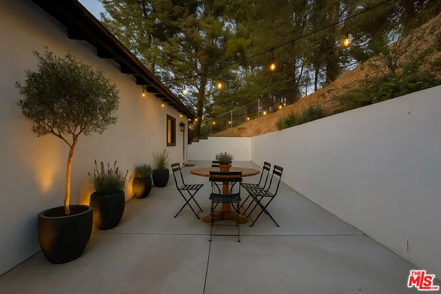 an aerial view of a house with outdoor space