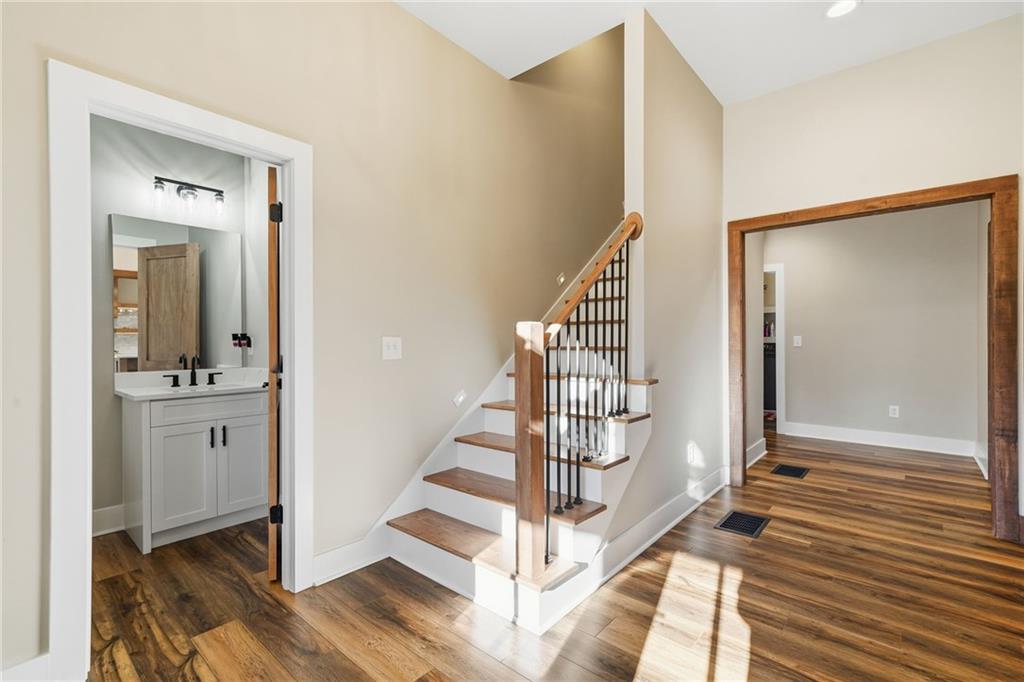 171 Hawthorne Hill Road Jasper, GA 30143 - Photo 17 of 51 a view of a hallway with wooden floor and staircase