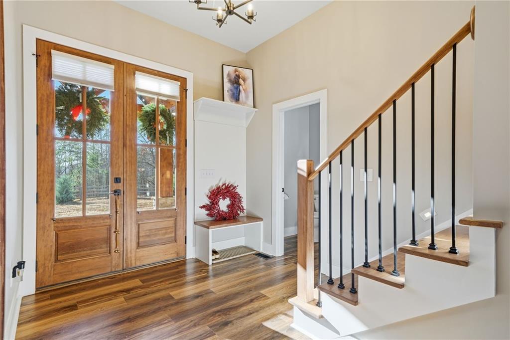 171 Hawthorne Hill Road Jasper, GA 30143 - Photo 18 of 51 a view of a hallway with wooden floor and windows