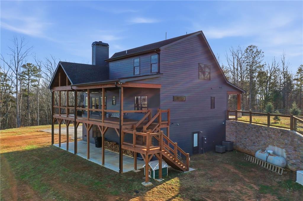 171 Hawthorne Hill Road Jasper, GA 30143 - Photo 3 of 51 a front view of a house with chairs