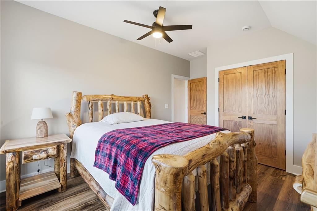 171 Hawthorne Hill Road Jasper, GA 30143 - Photo 39 of 51 a bedroom with a bed and a chandelier