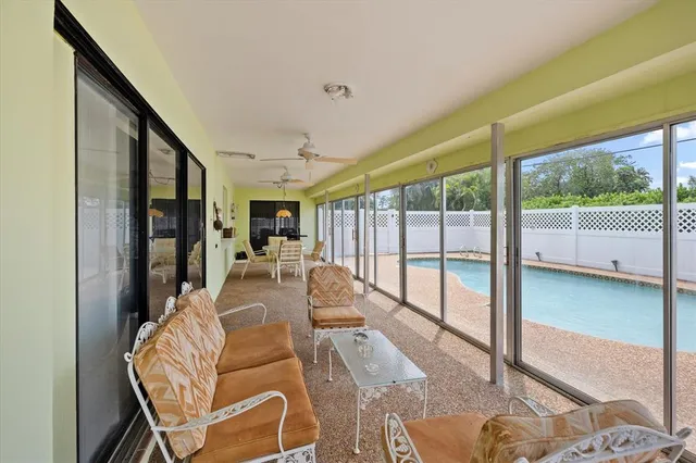 a view of a living room and a balcony