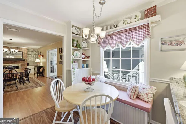 a very nice looking dining room with a table and chairs