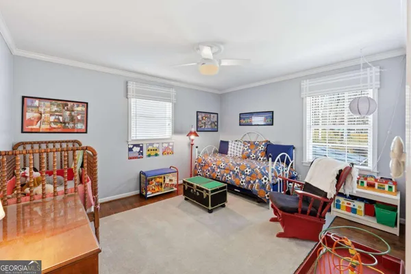 a bedroom with a large bed and a couch