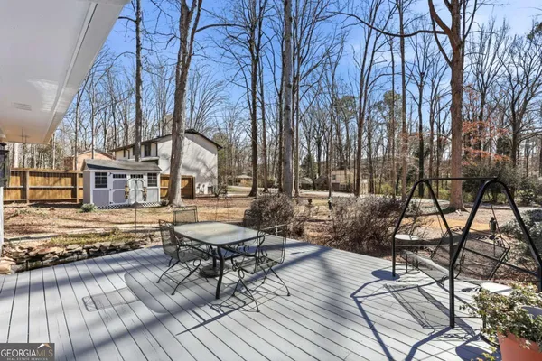 a view of a chairs and table on the wooden floor