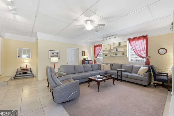 a view of a city with lush green forest