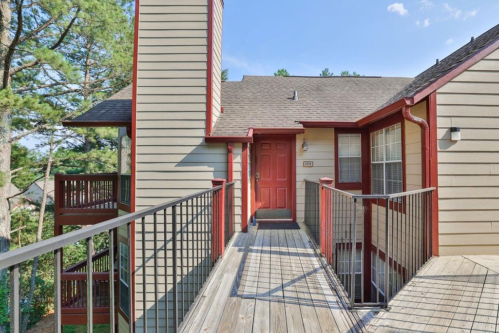 1215 Waterville Court, Unit 235 Johns Creek, GA 30022 - Photo 1 of 1 a view of a balcony with wooden floor and fence
