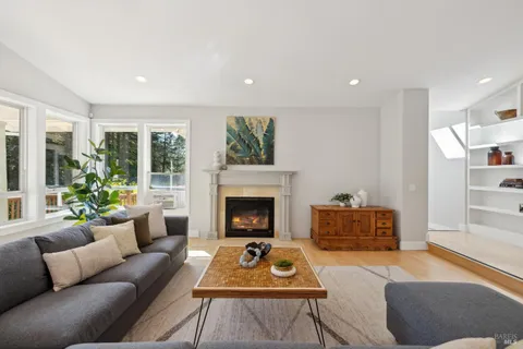 a workspace with wooden floor and a window