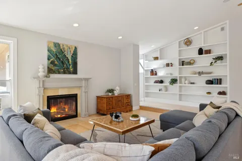 a large kitchen with a table and chairs