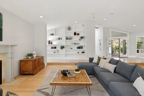a kitchen with a stove kitchen island and stainless steel appliances