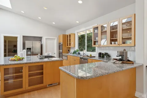 a spacious bedroom with a bed and a couch