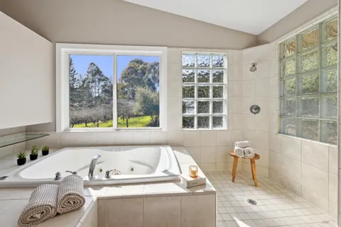 a view of a house with a yard and sitting area