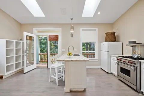 a view of a house with backyard and porch