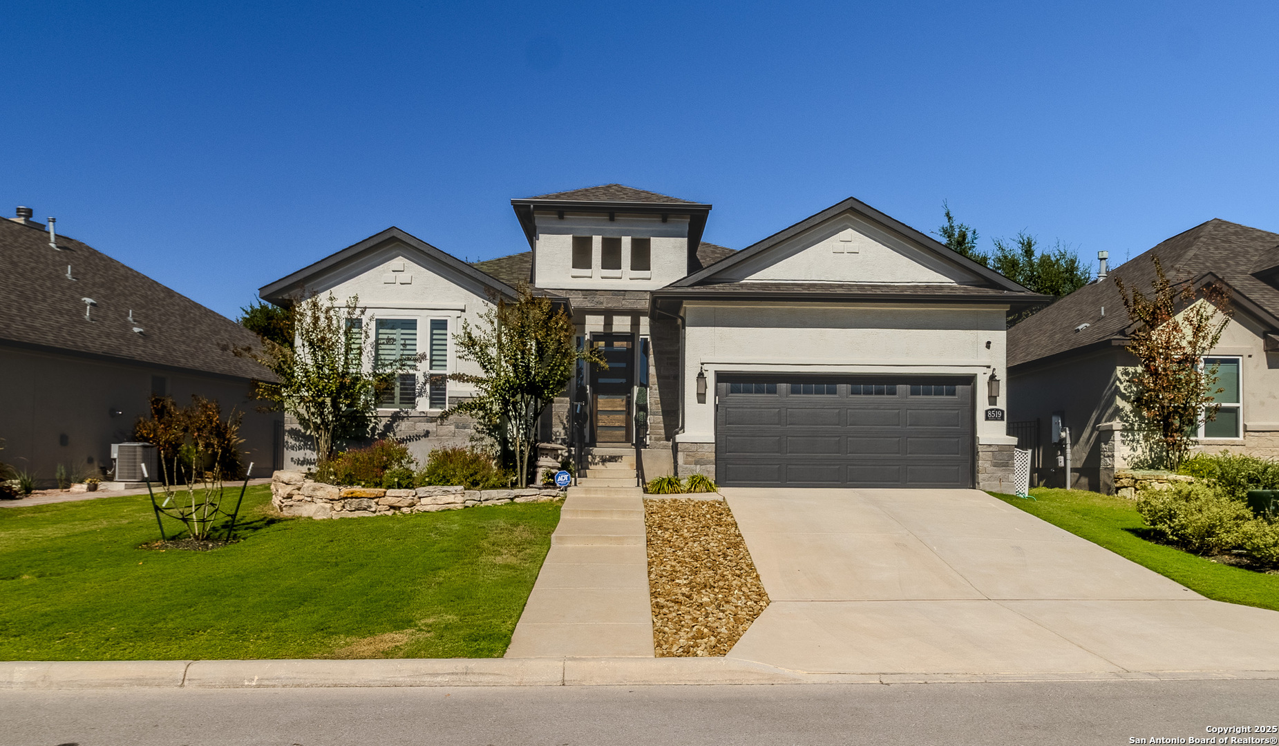 8519 Nichols Tree Boerne, TX 78015 - Photo 1 of 27 a front view of a house with a yard and garage