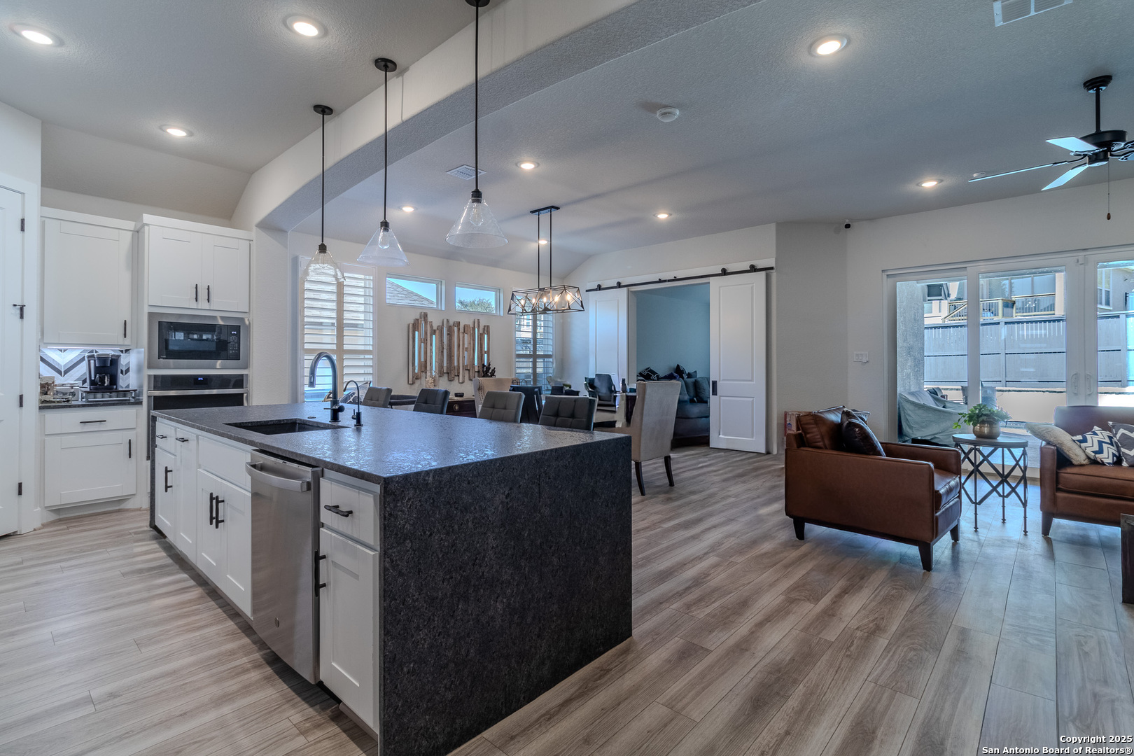 8519 Nichols Tree Boerne, TX 78015 - Photo 11 of 27 a large kitchen with stainless steel appliances lots of counter space and wooden floor