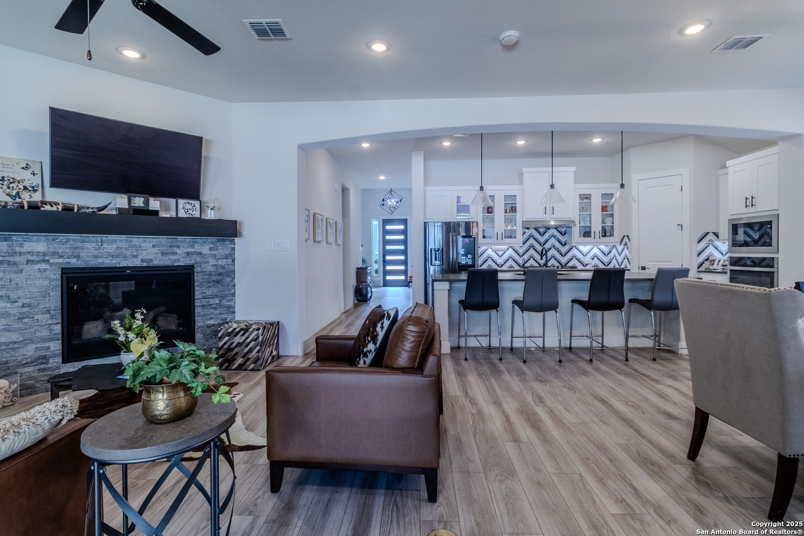 8519 Nichols Tree Boerne, TX 78015 - Photo 14 of 27 a living room with furniture and a fireplace