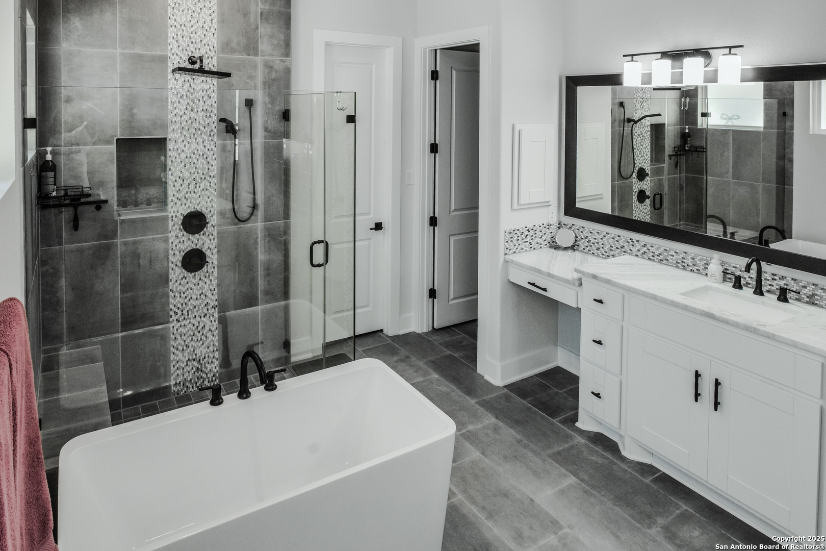 8519 Nichols Tree Boerne, TX 78015 - Photo 18 of 27 a bathroom with a tub sink mirror and shower