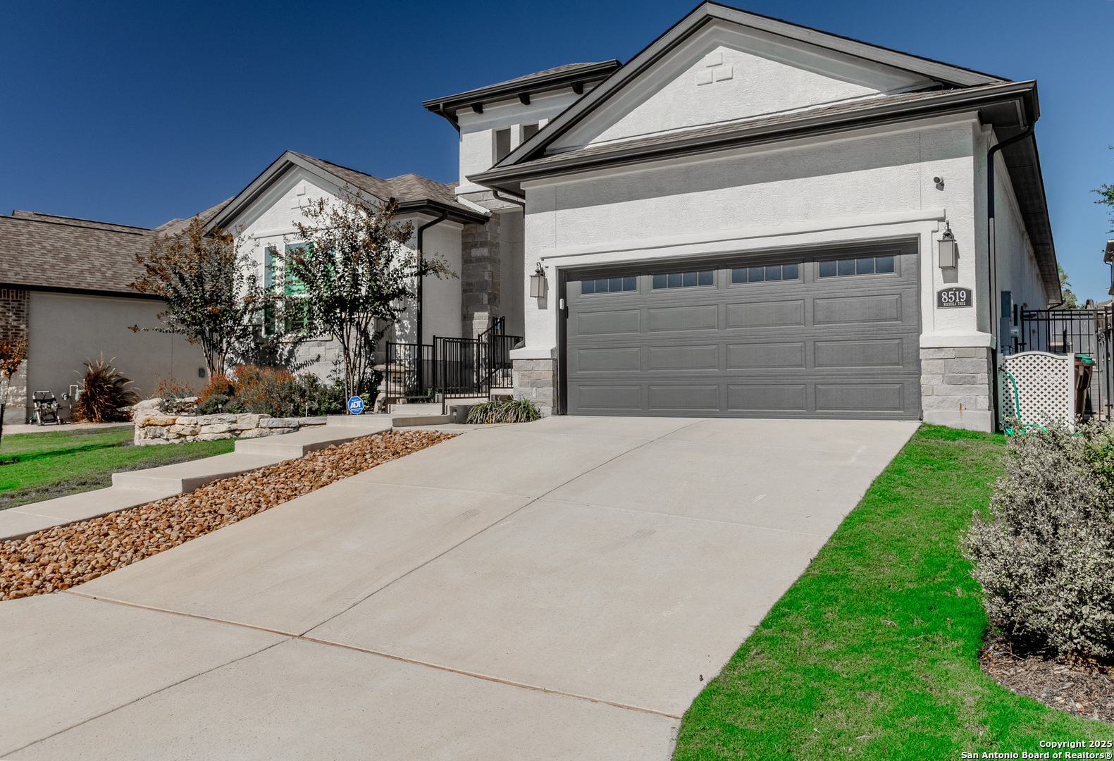 8519 Nichols Tree Boerne, TX 78015 - Photo 27 of 27 a front view of a house with a yard and garage