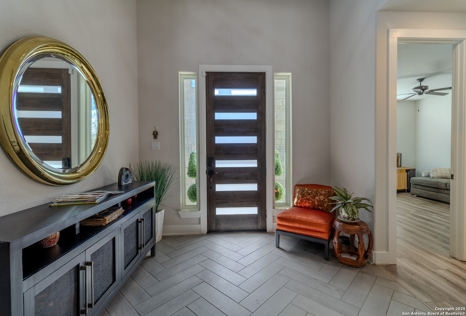 8519 Nichols Tree Boerne, TX 78015 - Photo 4 of 27 a living room with furniture and a mirror