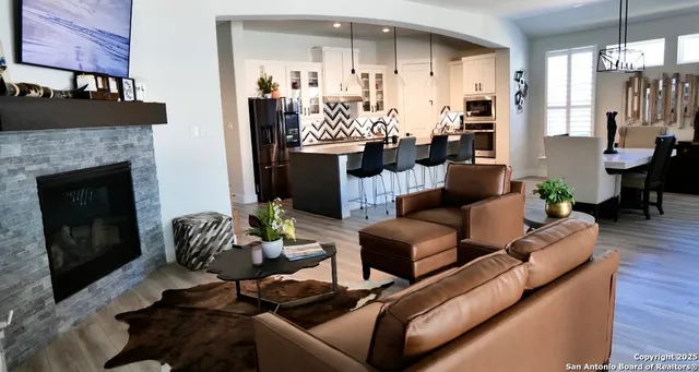 a living room with furniture and a window