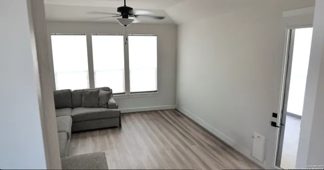 a bathroom with a sink a mirror a bathtub and shower