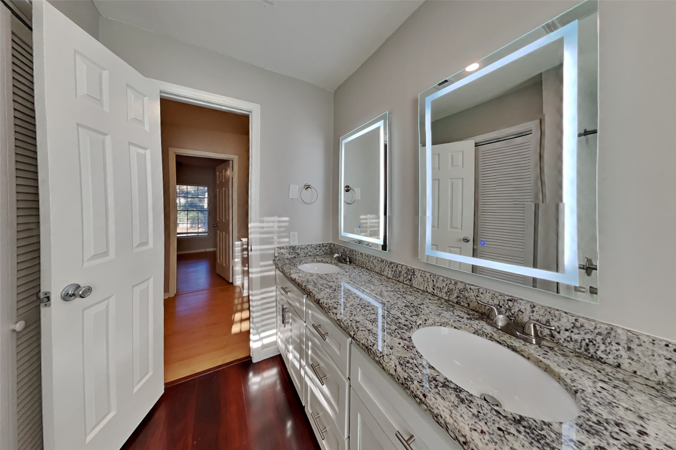 7611 Round Grove Lane Houston, TX 77095 - Photo 18 of 22 a bathroom with a granite countertop double vanity sink and a mirror