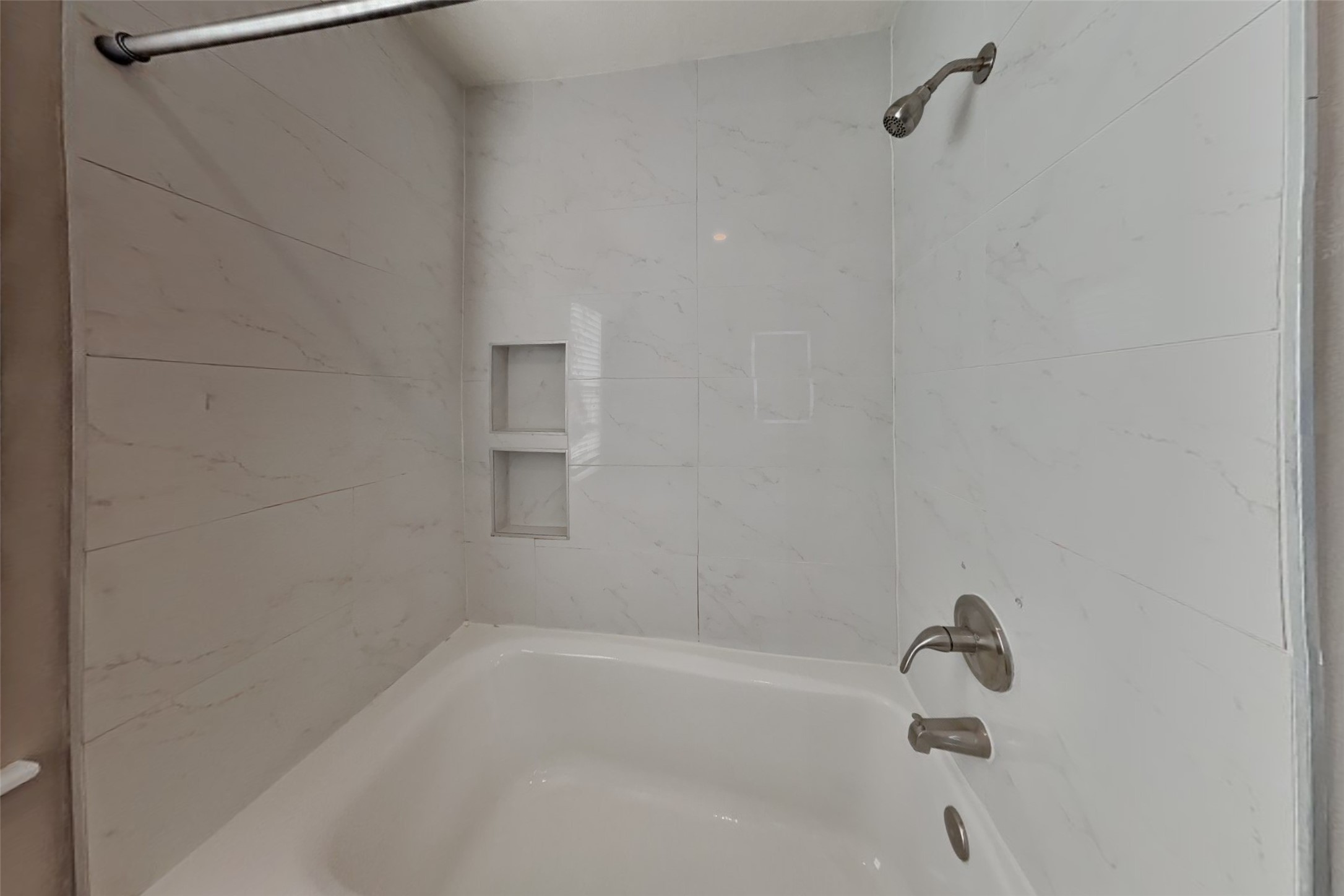 7611 Round Grove Lane Houston, TX 77095 - Photo 19 of 22 a bathroom with a bathtub