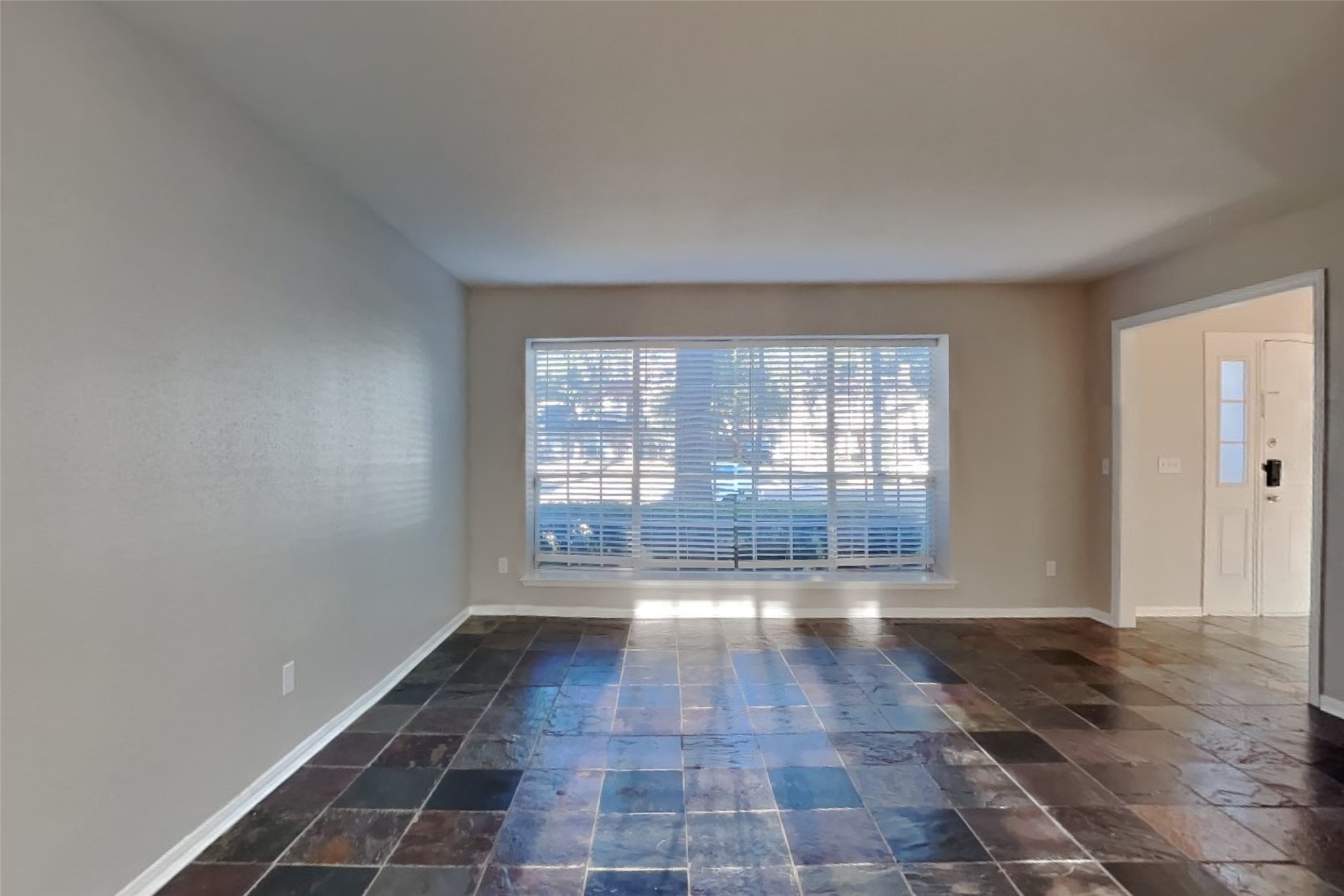 7611 Round Grove Lane Houston, TX 77095 - Photo 2 of 22 a view of an empty room with a window