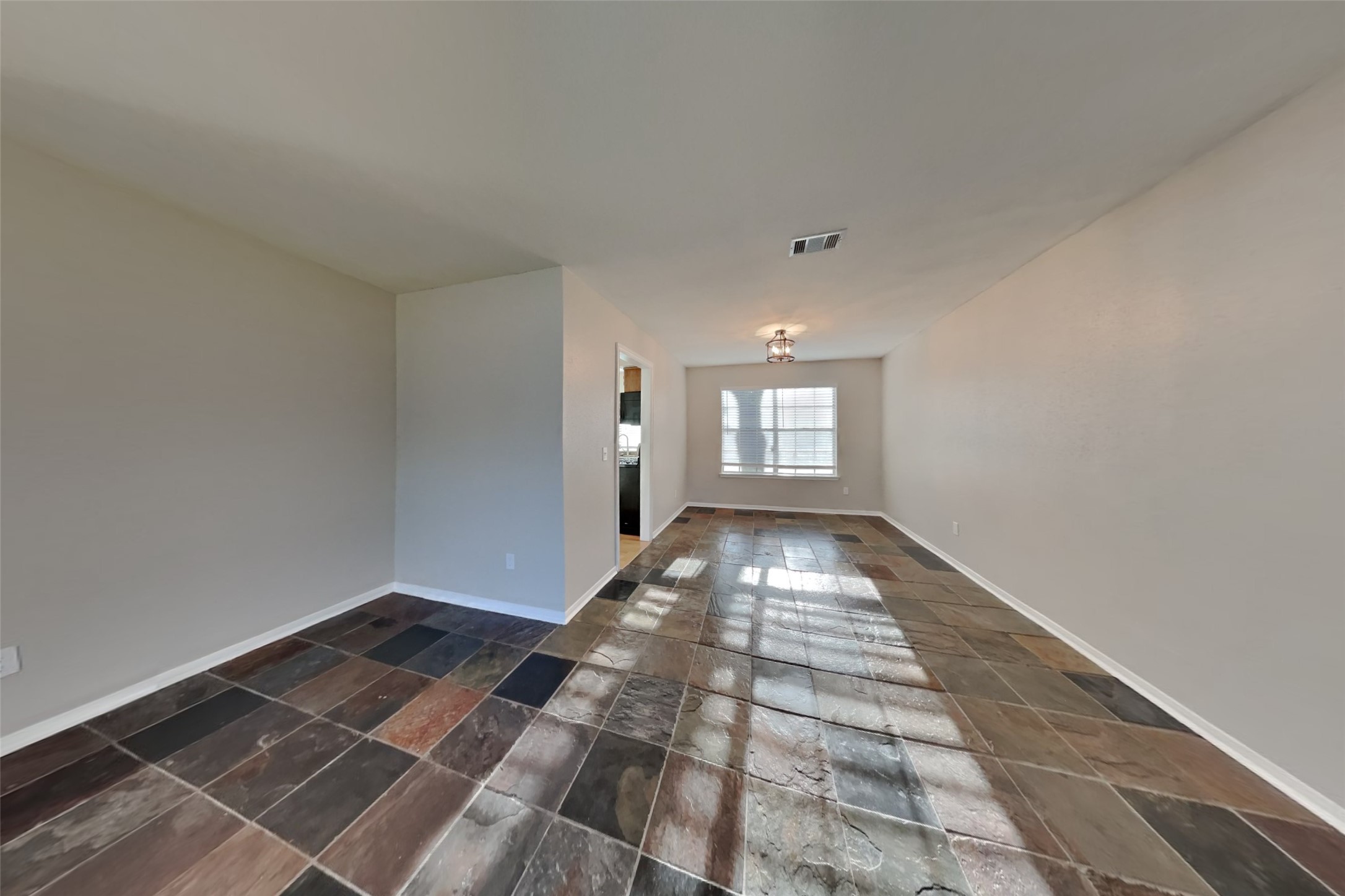 7611 Round Grove Lane Houston, TX 77095 - Photo 3 of 22 a view of a room with wooden floor and white walls