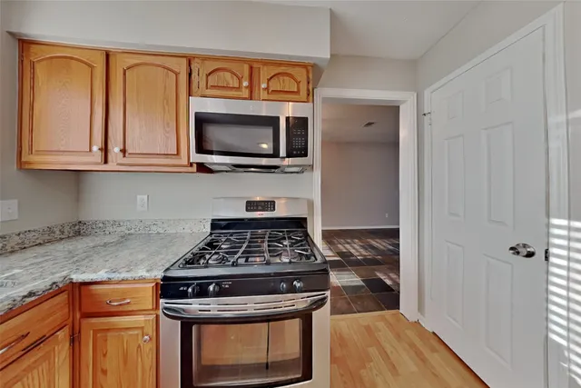 a kitchen with a stove and a microwave