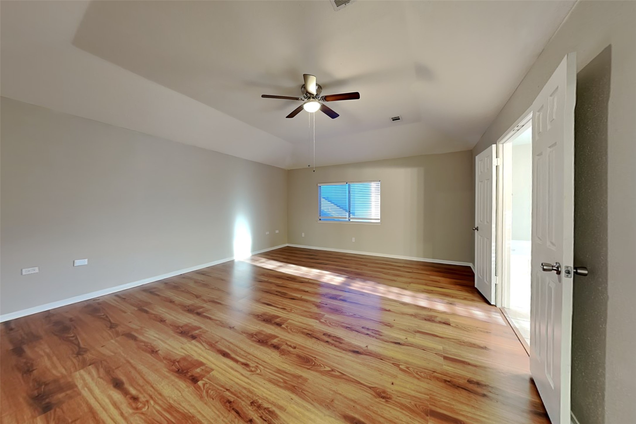 7611 Round Grove Lane Houston, TX 77095 - Photo 9 of 22 a view of empty room with wooden floor and fan