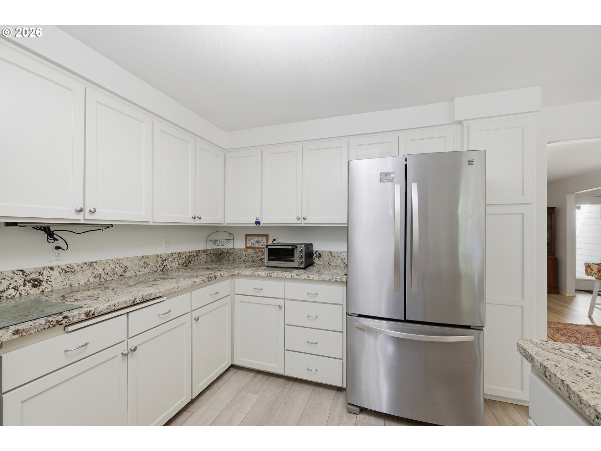 88119 Tiki Lane Springfield, OR 97478 - Photo 12 of 35 a kitchen with stainless steel appliances a refrigerator sink and cabinets