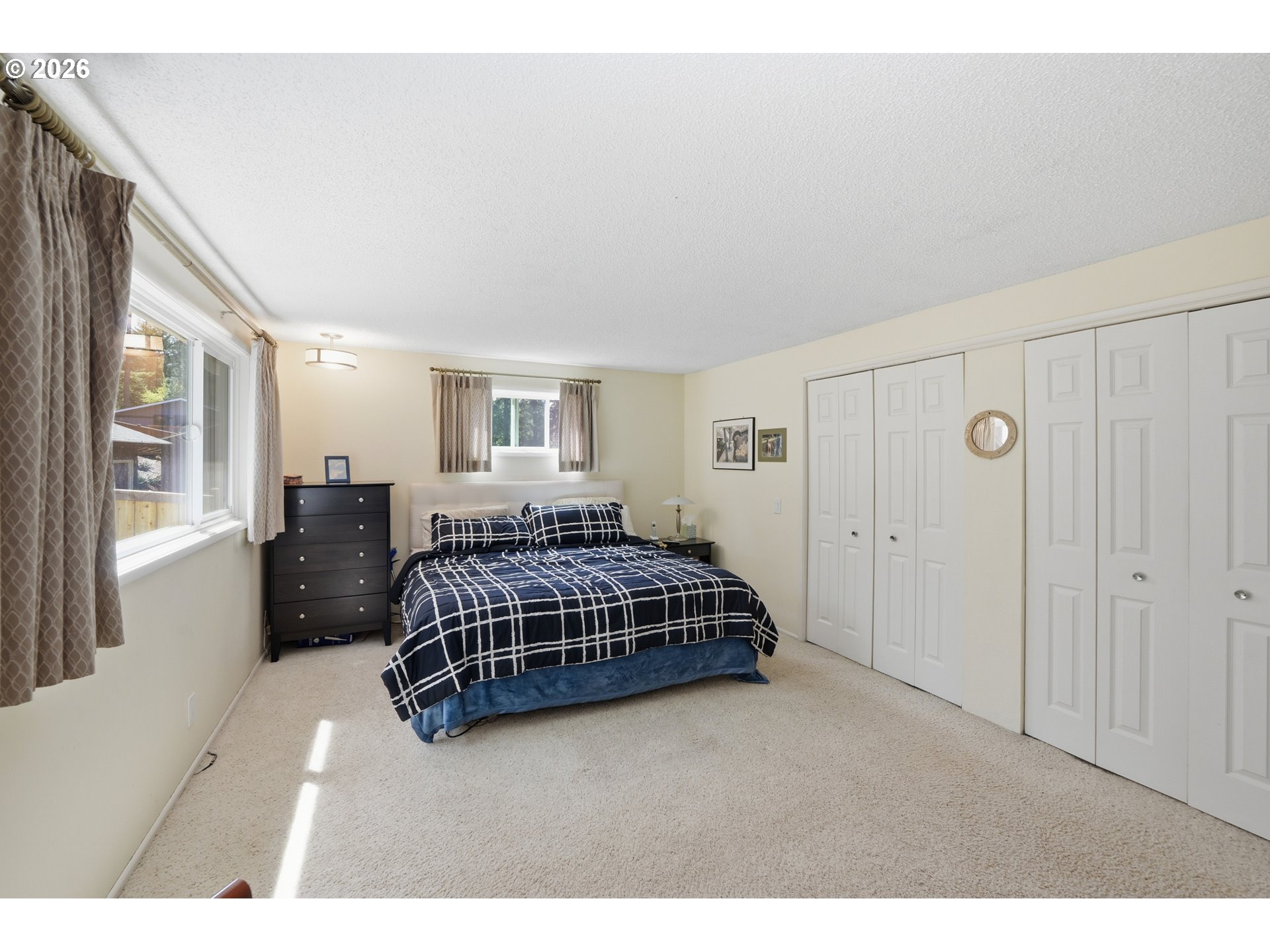 88119 Tiki Lane Springfield, OR 97478 - Photo 21 of 35 a bedroom with a bed window and a night stand