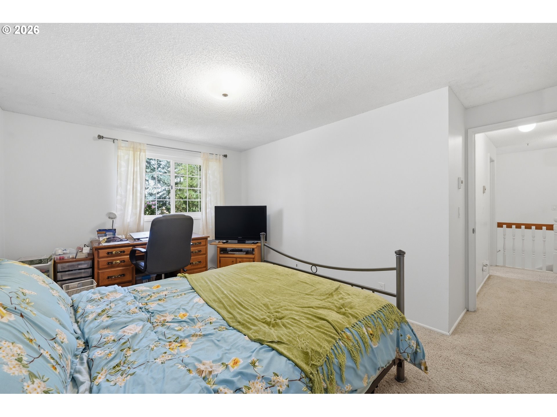 88119 Tiki Lane Springfield, OR 97478 - Photo 25 of 35 a bedroom with a bed and wooden floor